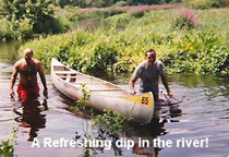 Canoe team standing in the Ipswich River