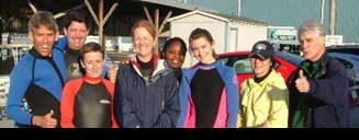 Team in water gear before an ocean adventure