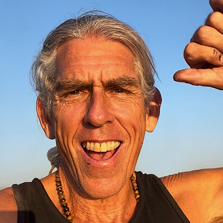 Joe Noonan smiling outdoors in warm sunlight