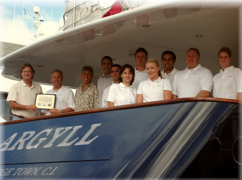 Joe receiving an award with a yacht team